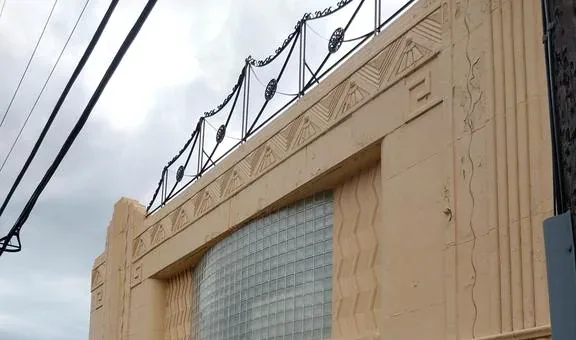 Upper commercial building facade and roof edge