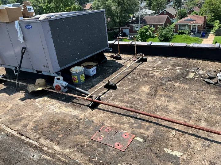 Existing roofing removal around rooftop equipment