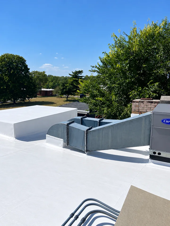 Re-coated roof with ductwork and curb details (retouched photo)
