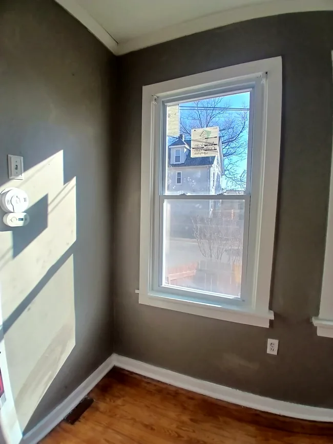 Interior window after trim and surrounding wall finishes were restored.