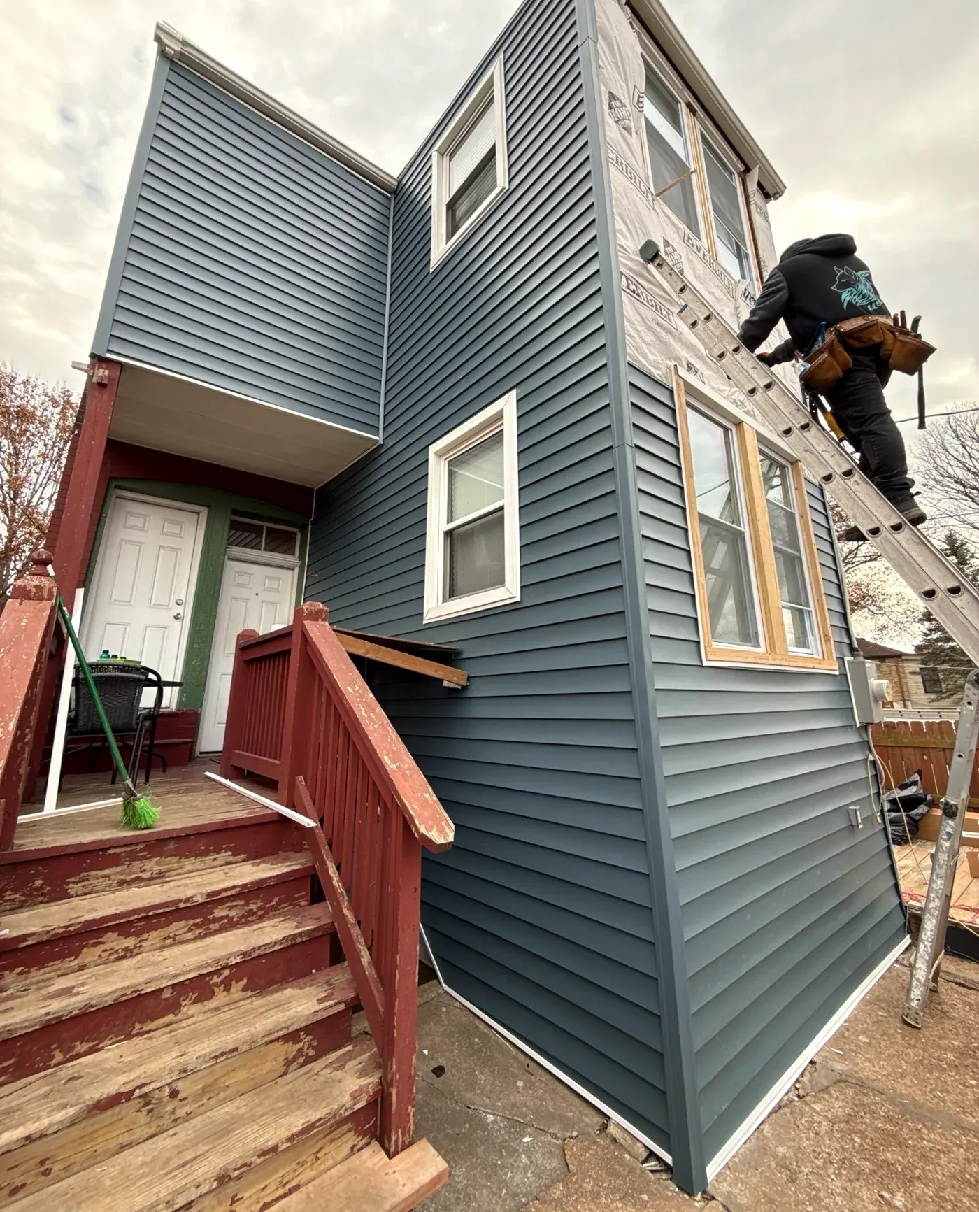 Siding installation during REHAB's St. Louis exterior restoration